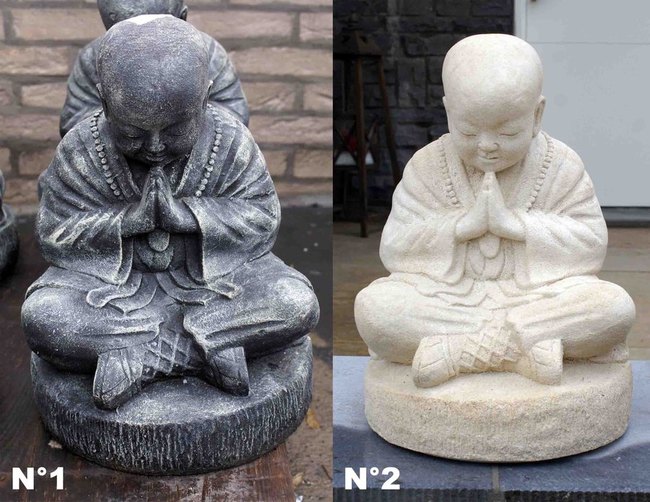 statue de bouddha blanche ou grise en pierre