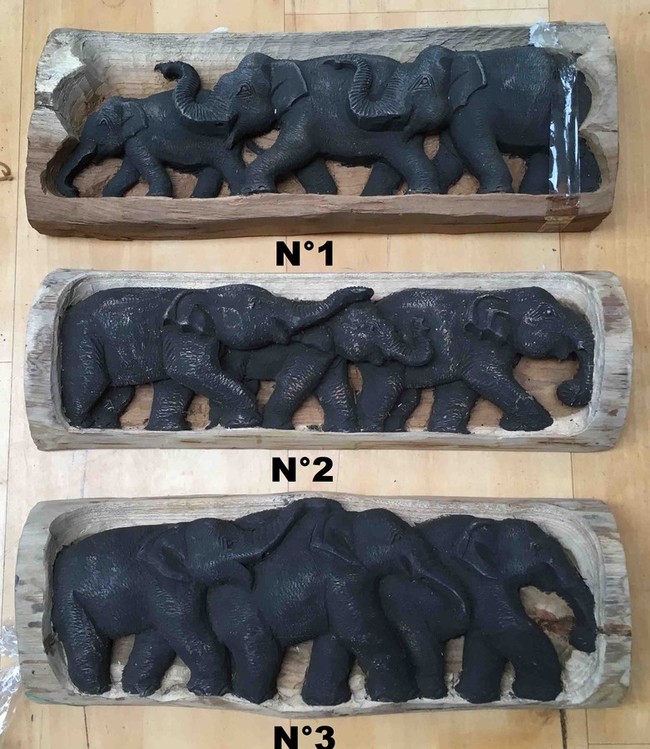 Statue éléphant sculptée dans un tronc de bois de teck