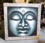 grand tableau peint d'une tête de Bouddha sur une toile tendue