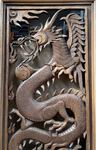 Grand cadre en bois sculpté d'un dragon