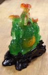 chèvre chinoise avec une calice pièce d'argent et porte bonheur