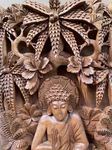 Cadre finement sculpté de Bouddha en bois de teck