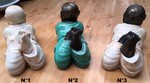 Grande statue de l'enfant Bouddha allongé en poly-résine peint