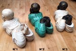 Grande statue de l'enfant Bouddha allongé en poly-résine